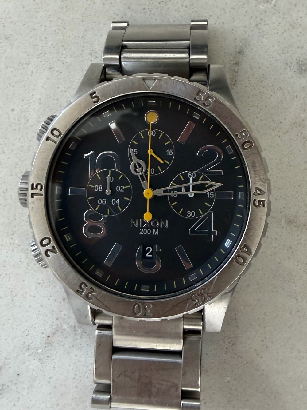 Nixon Stainless Steel Chronograph Watch — Black Dial with Yellow Accents